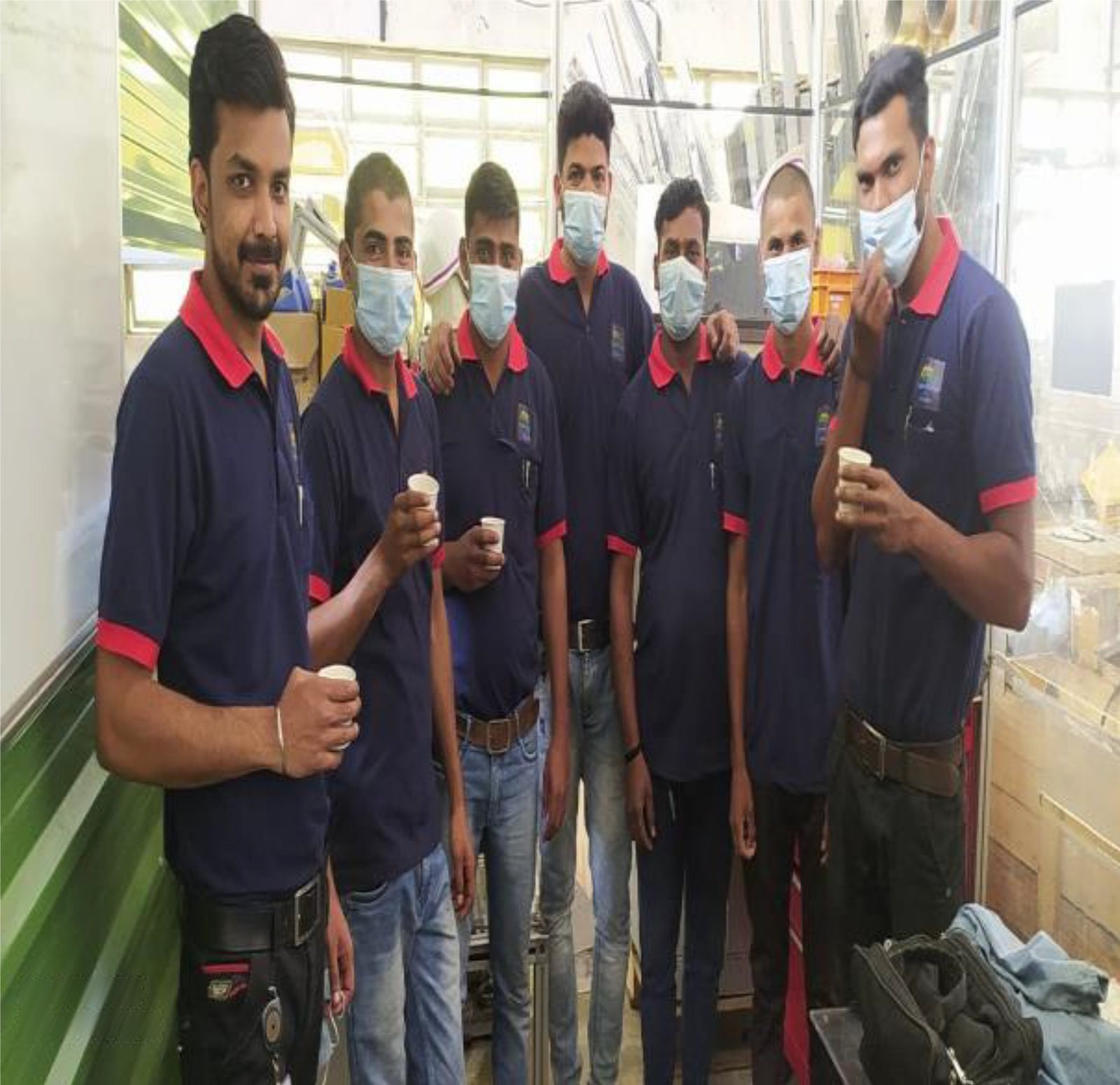 Yoganand technicians in uniform