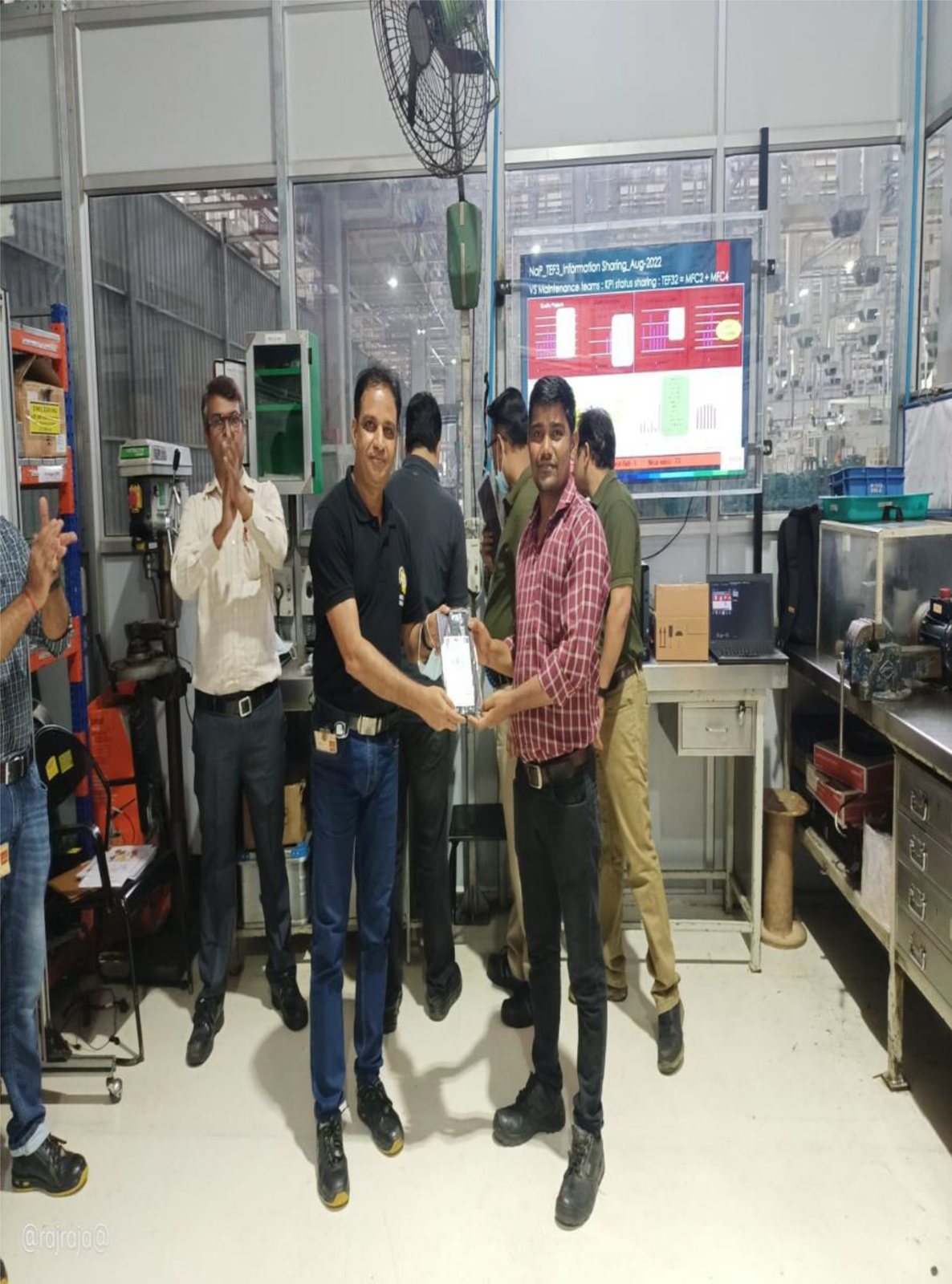 Team with a client on the shop floor