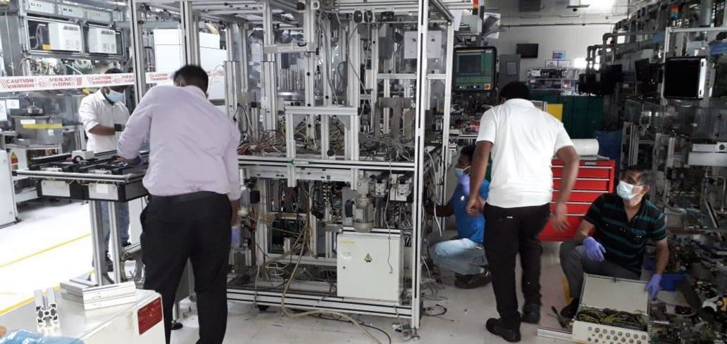 Yoganand technicians working on an assembly line